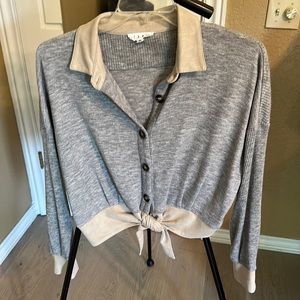 Pretty gray/tan tie front sweater.  Acrylic/spandex blend.